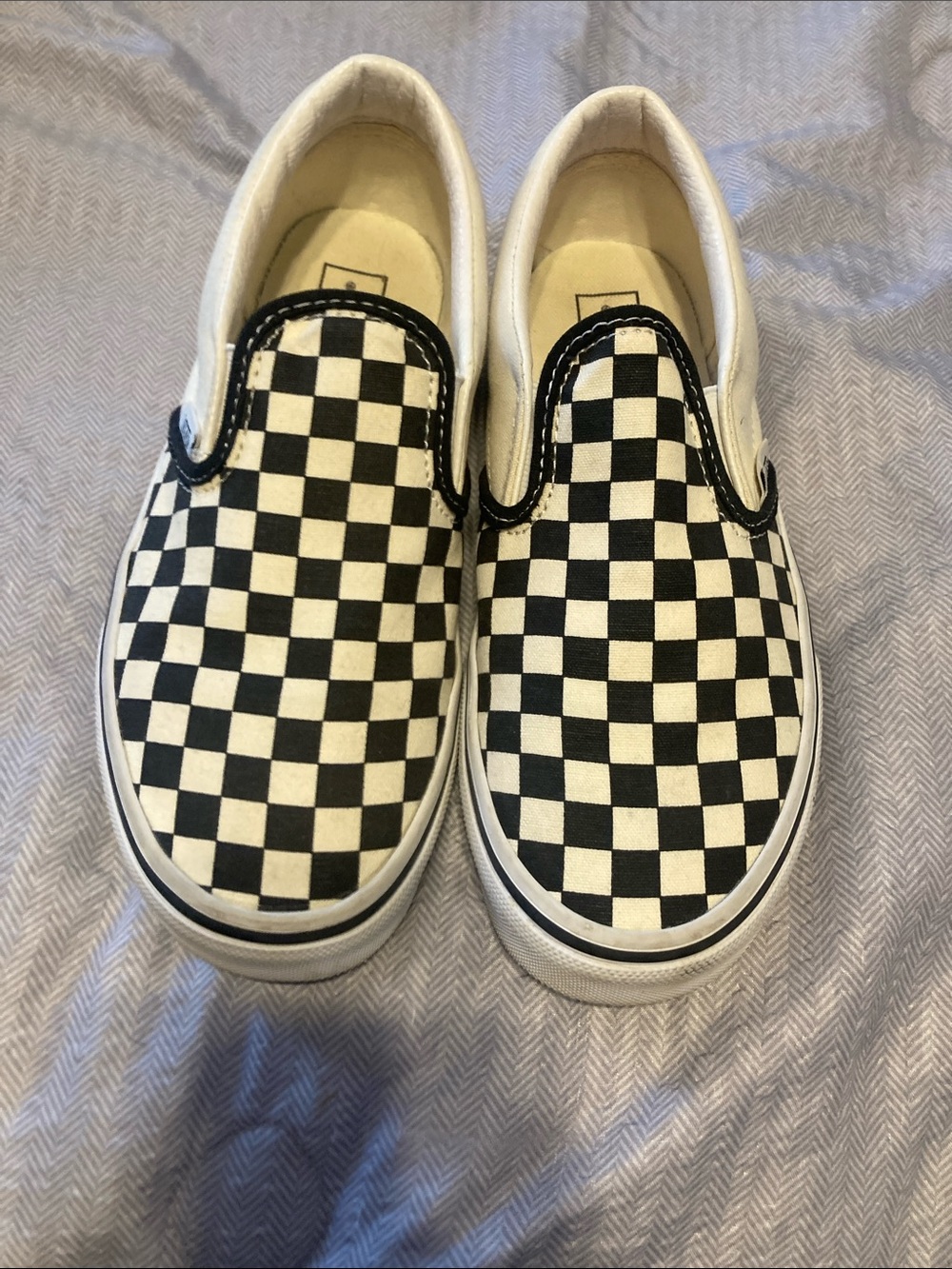 Vans black and white checkered slip ons